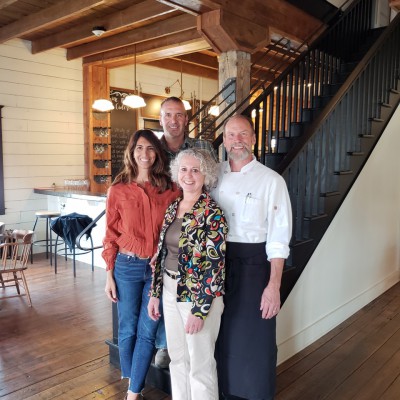 Karin and Gust Tsiatsos with Deb and Merlyn Baker in The Landing's lobby. 