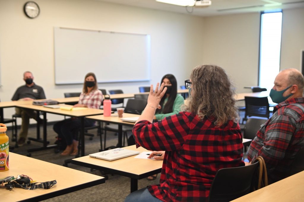 Screenwriter Sarah Greenman leads a script development meeting for the Urban-Rural Theatre Project.