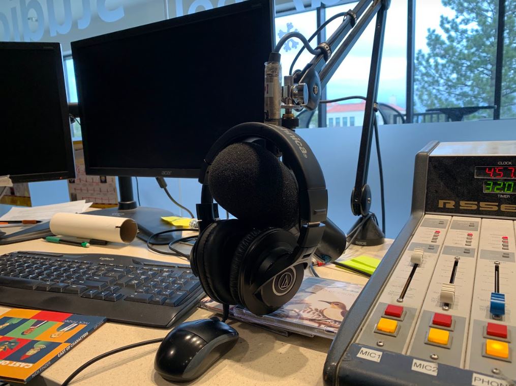 Image of the old KEOL studio microphone stand, monitors and mixing board 