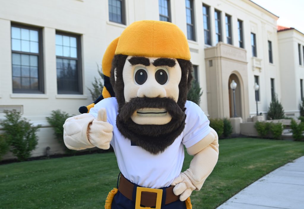 Monty the Mountaineer giving a thumbs up.